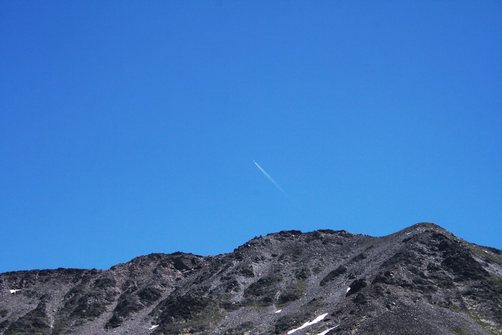 contrail over the hill
