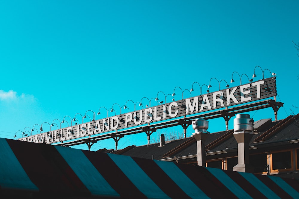 rectangular white and black island public market signage