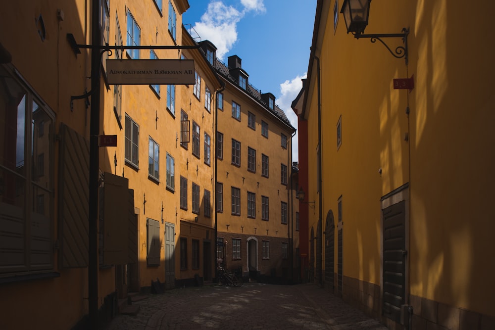 pathway between buildings at daytime