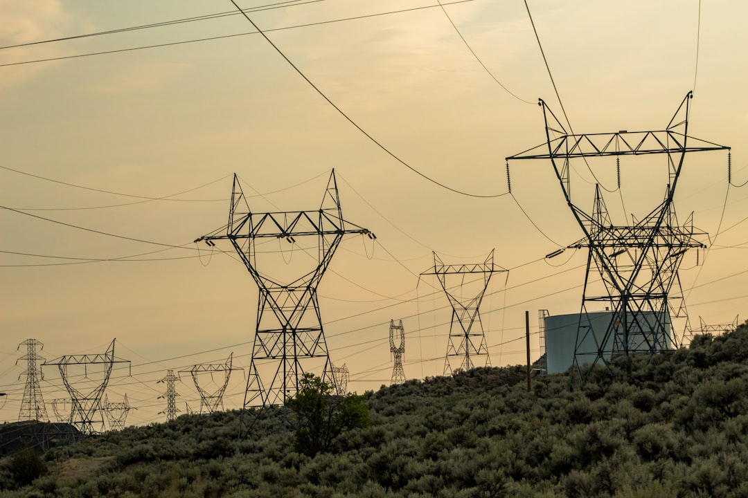 silhouette of electric utility post,