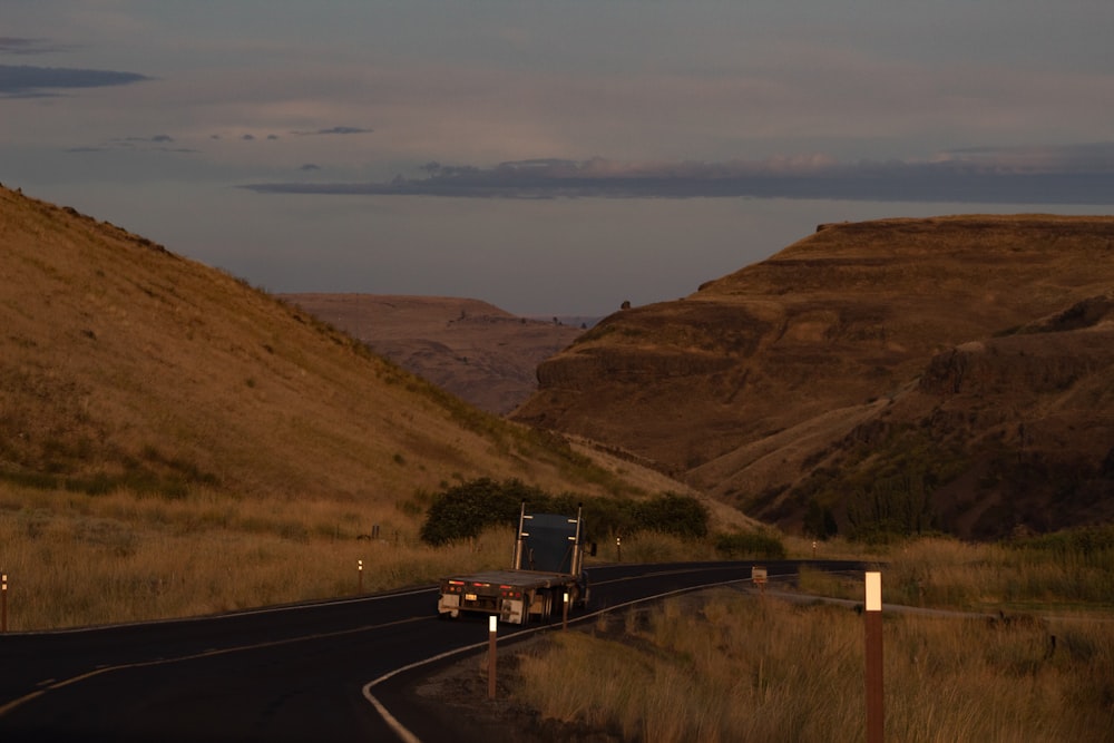 flatbed trailer truck on winding road