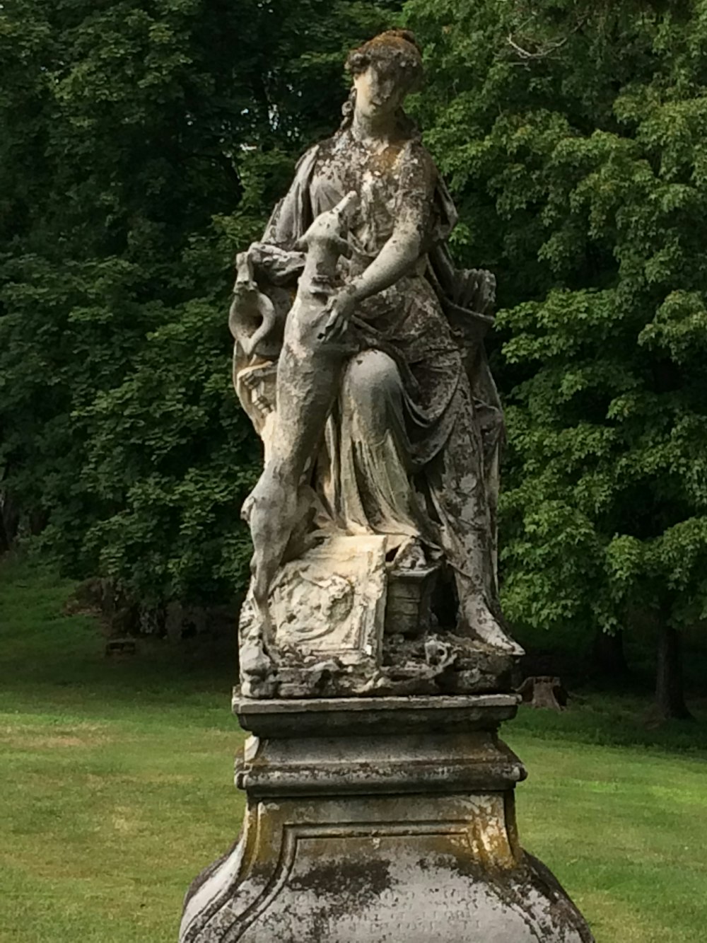 woman in brown dress statue