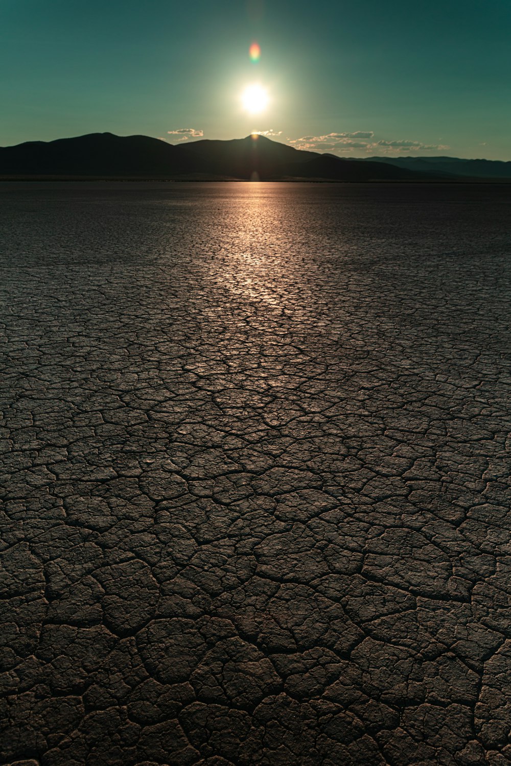 dried soils near mountain at daytime