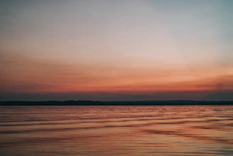 A peaceful sunset with soft colors representing calm and healing energy.