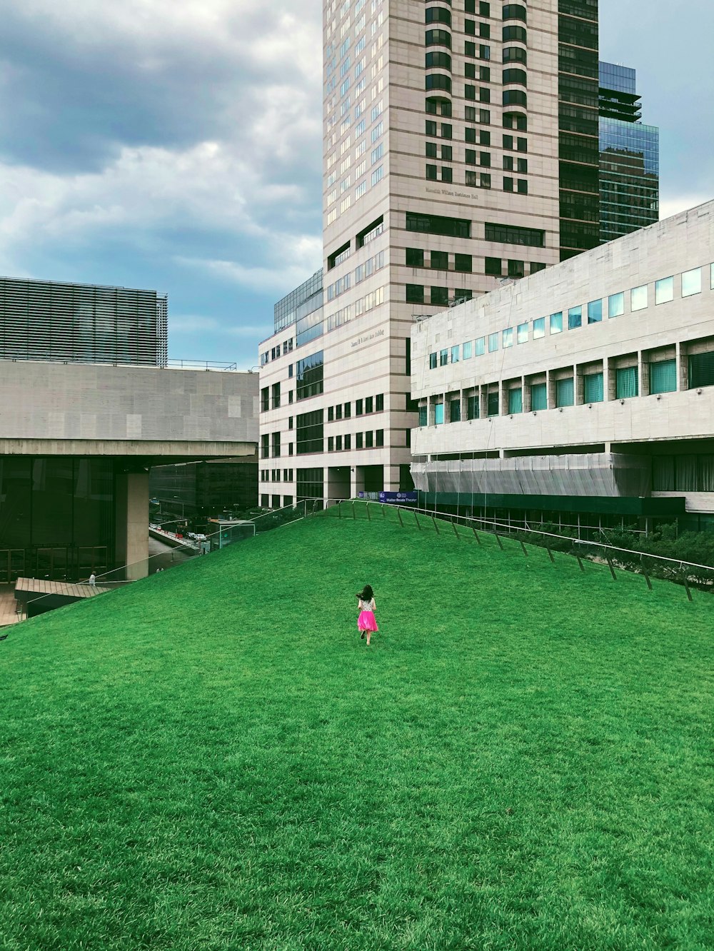 woman walking near outdoor beside building during daytime