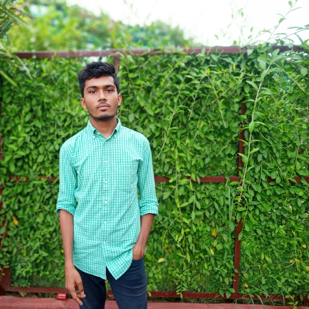 man standing in front of plants