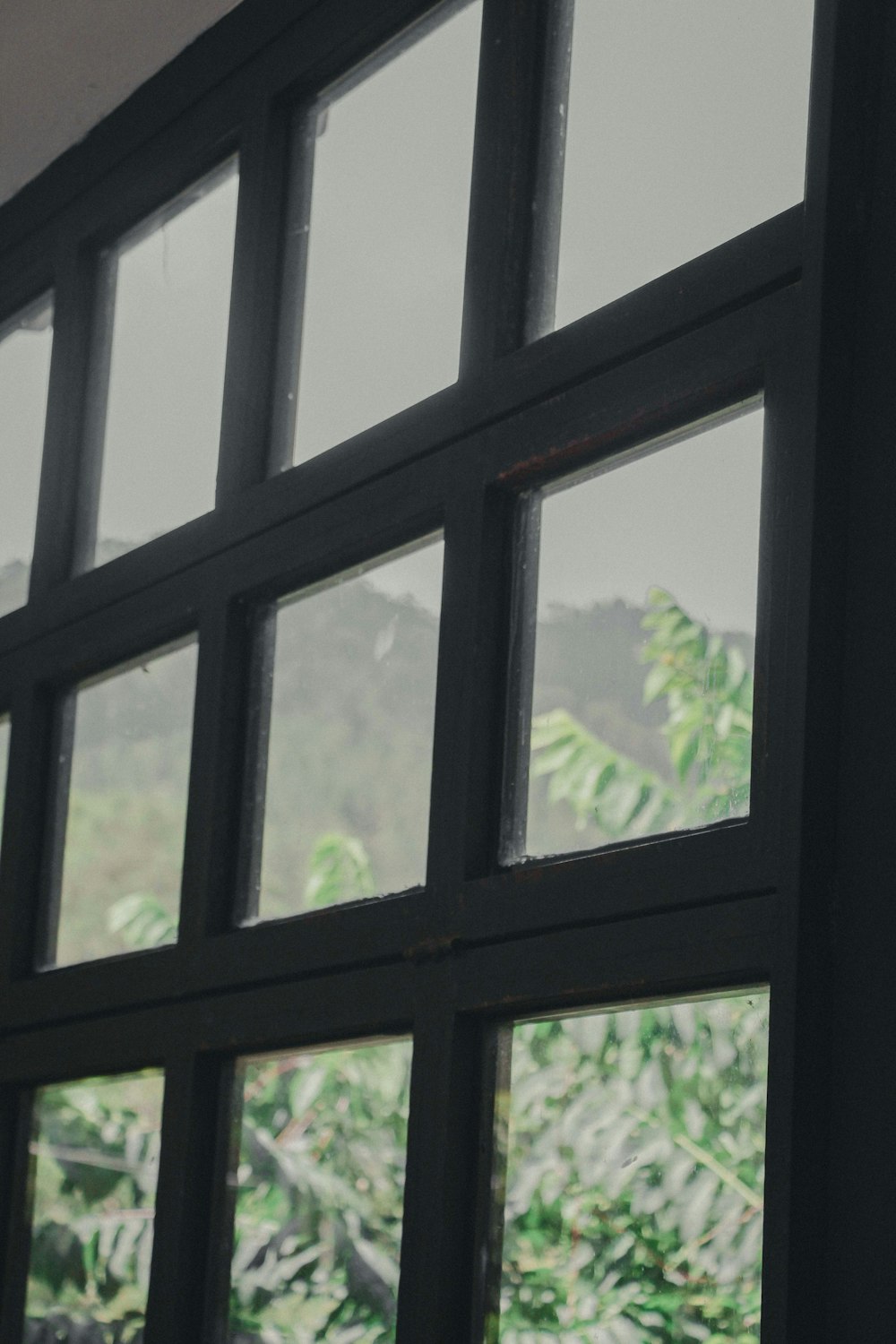 black wooden framed and clear glass window pane