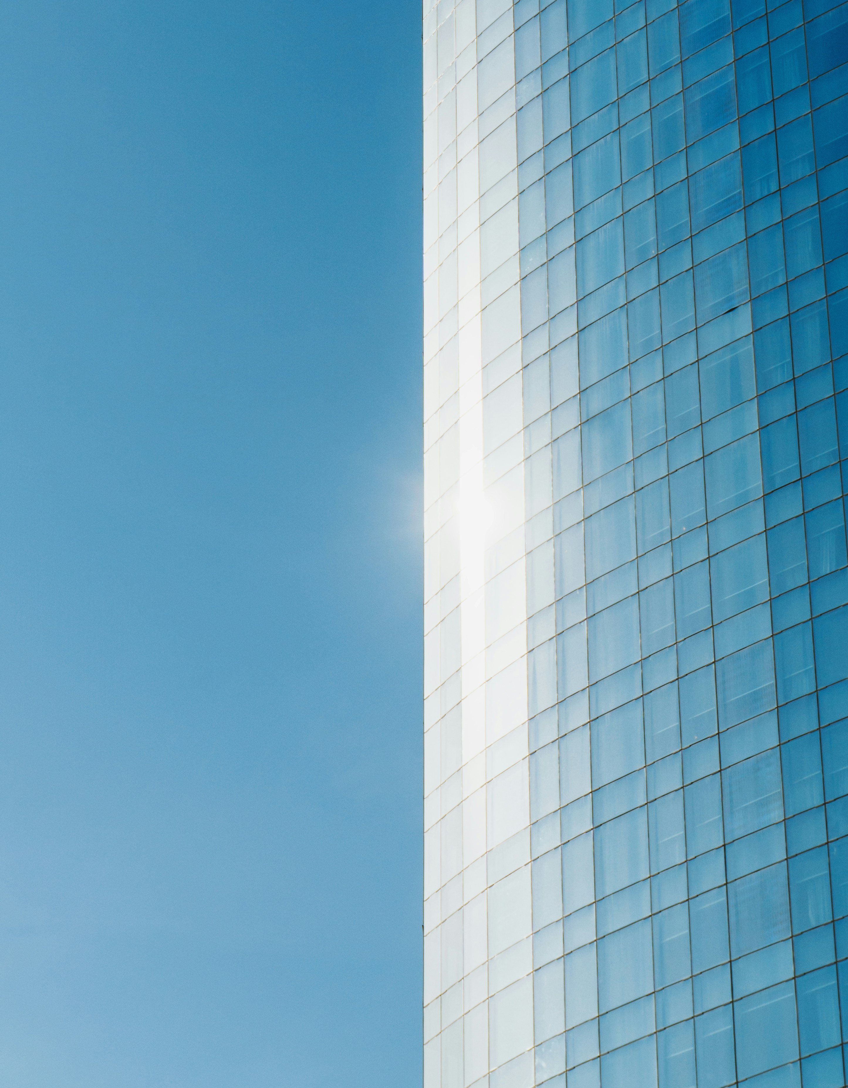 blue glass building photography