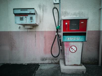 Close-up of a fuel pump terminal displaying 'tu zapłacisz' sign.