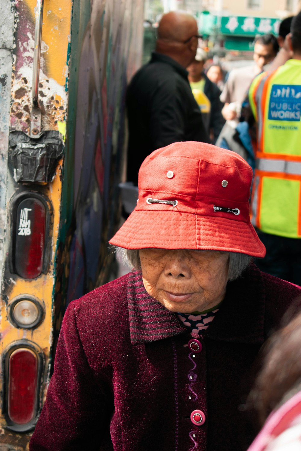 woman wearing red bucket hat