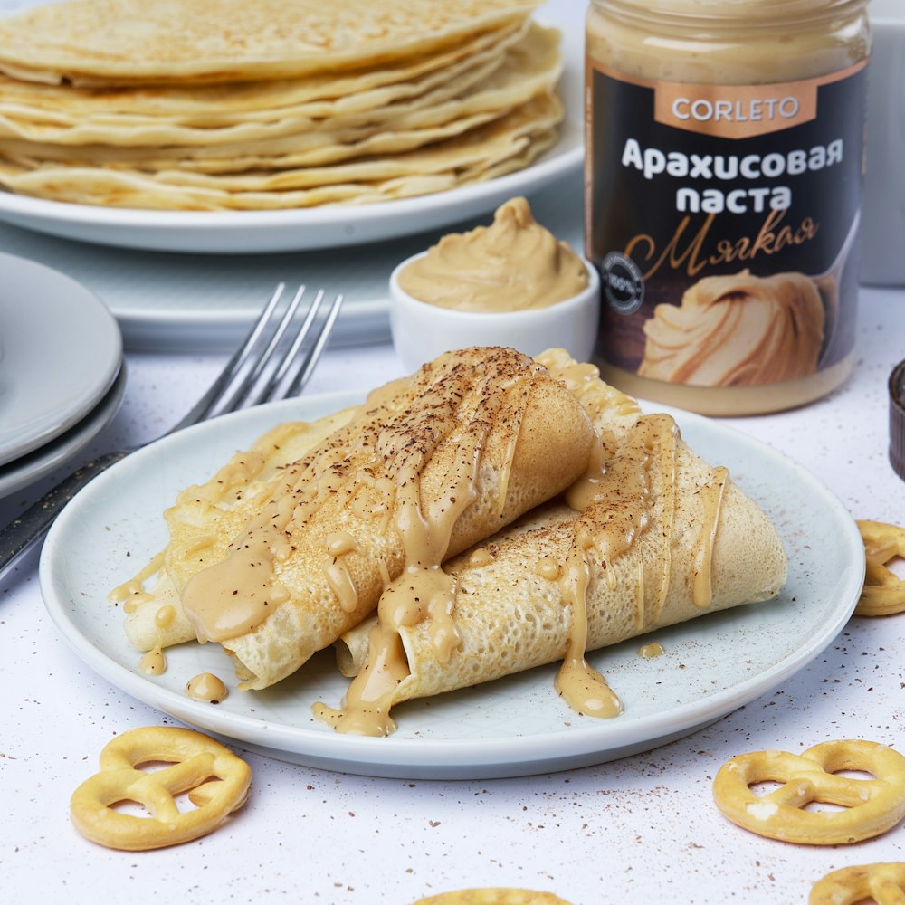 baked creepes served on white ceramic plate