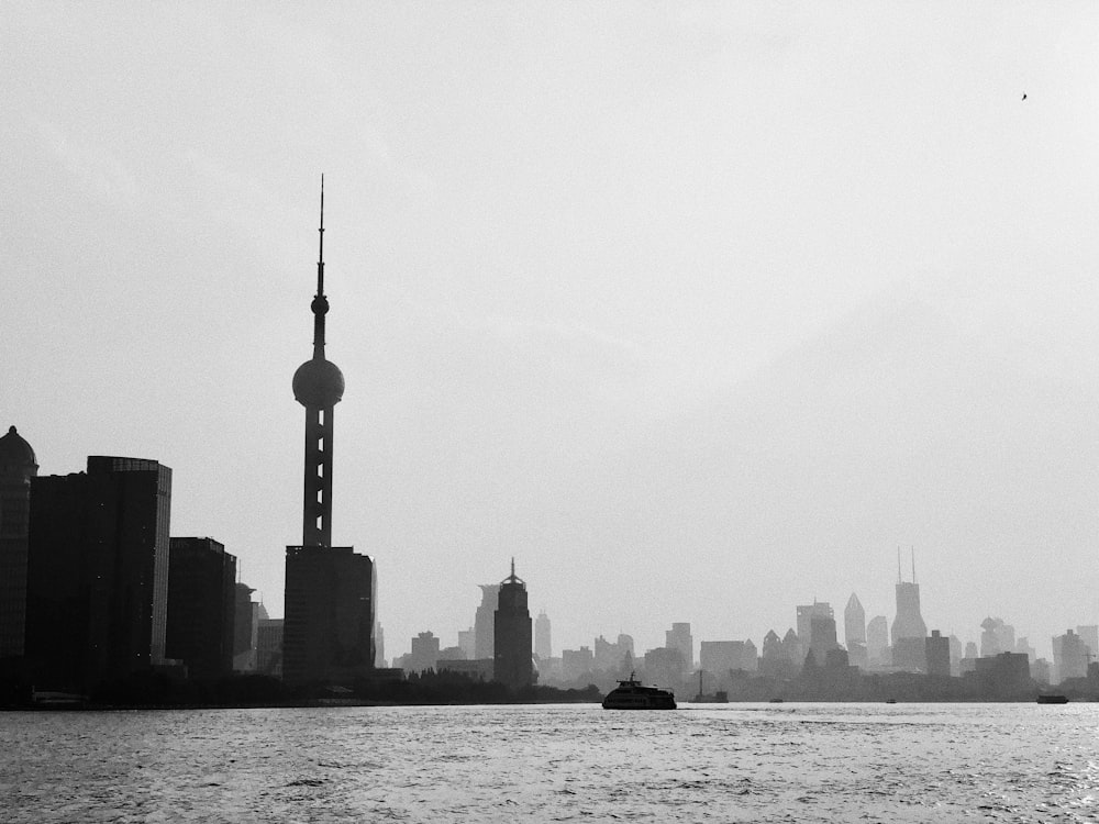 a large body of water with a city in the background