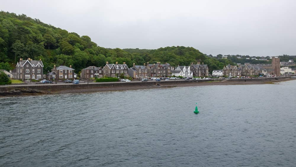 green sailboat on sea