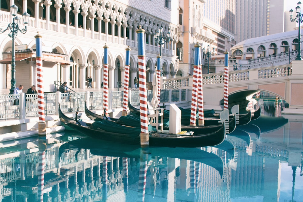 a gondola in the middle of a canal in a city