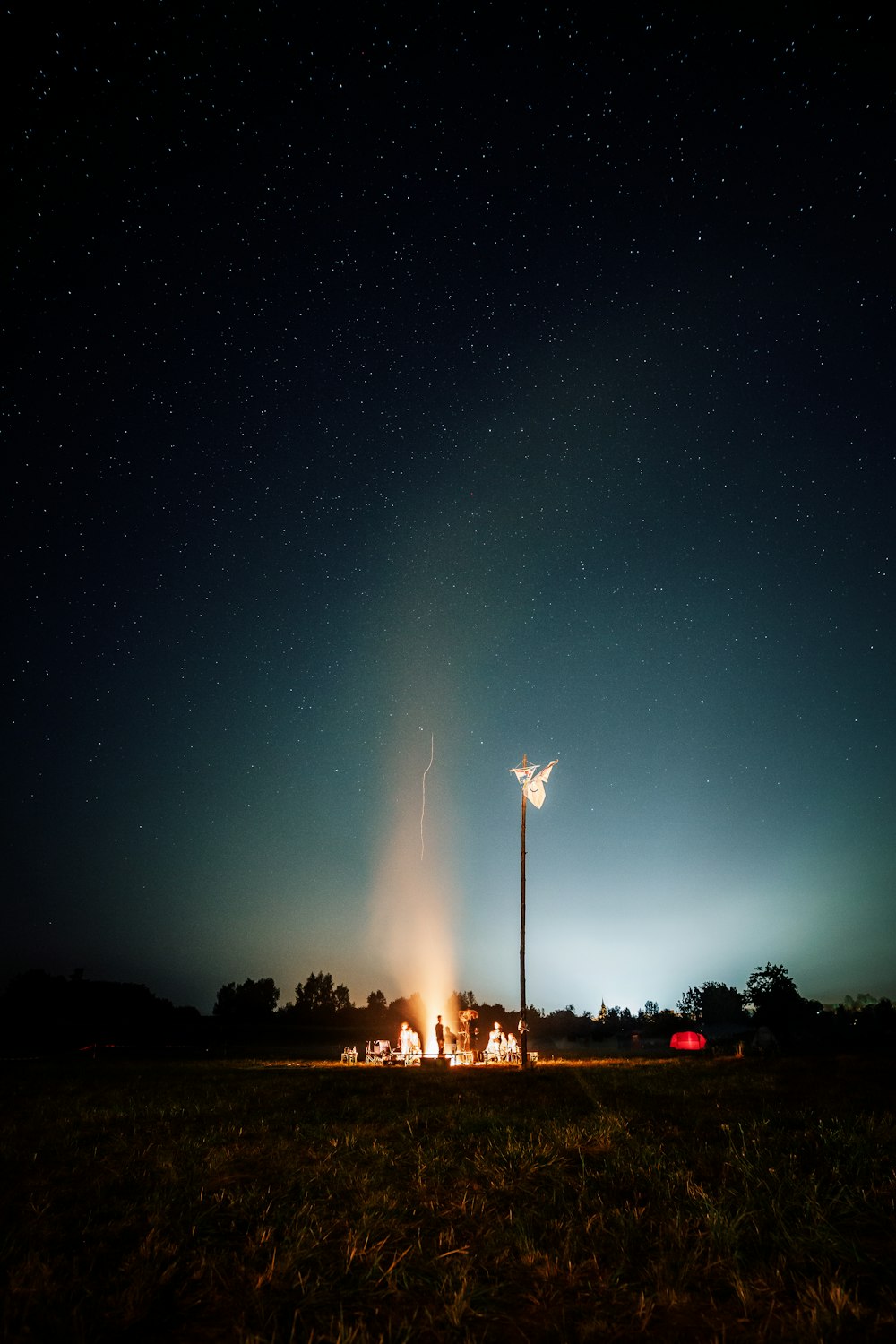 person standing beside bonfire during night