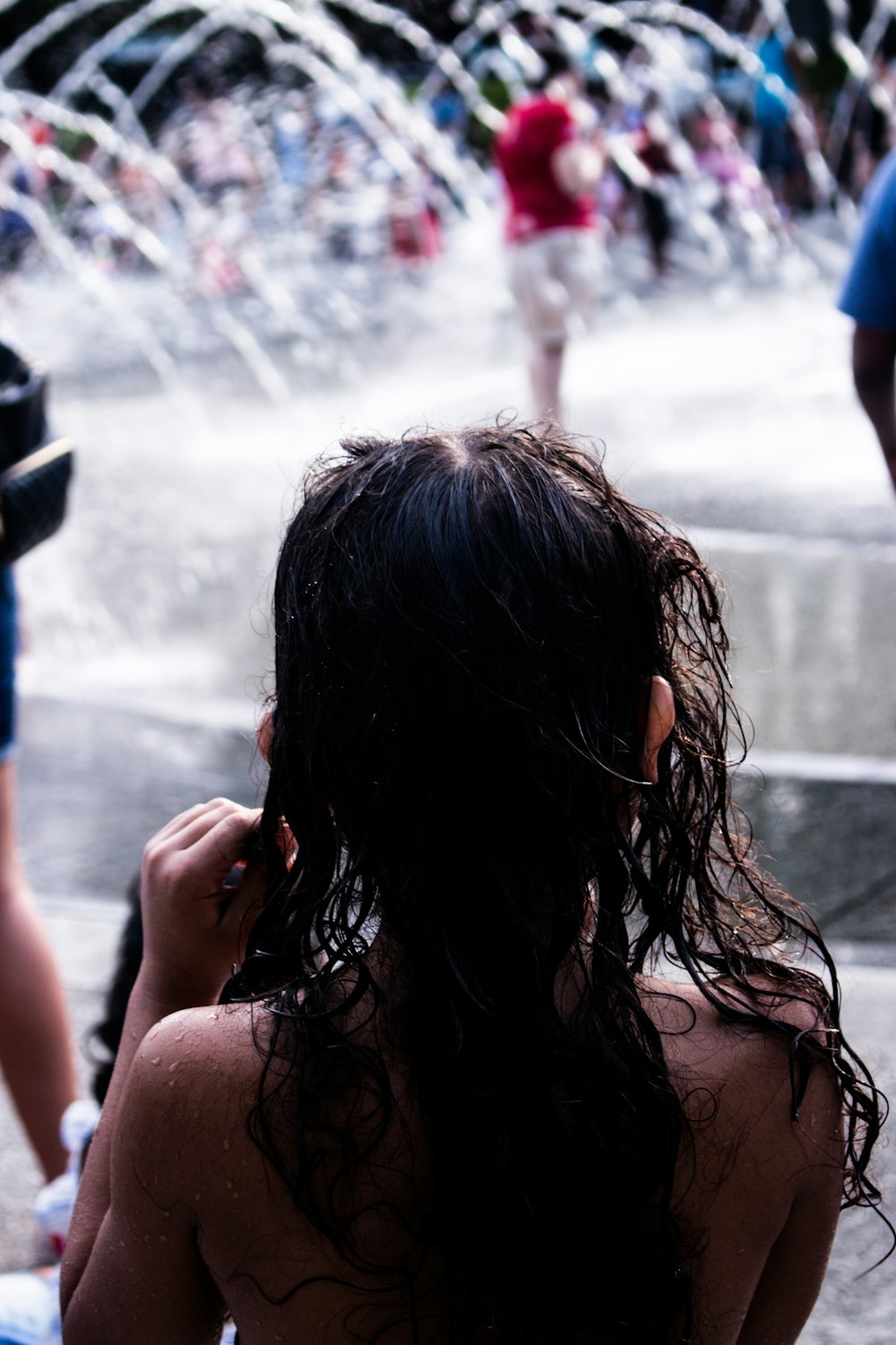 topless girl near fountain