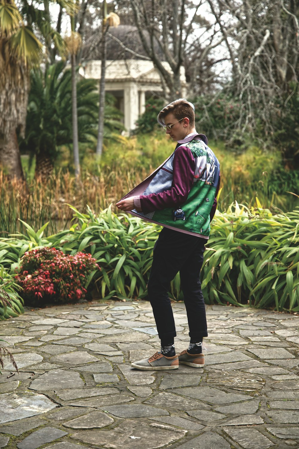 man standing near plants