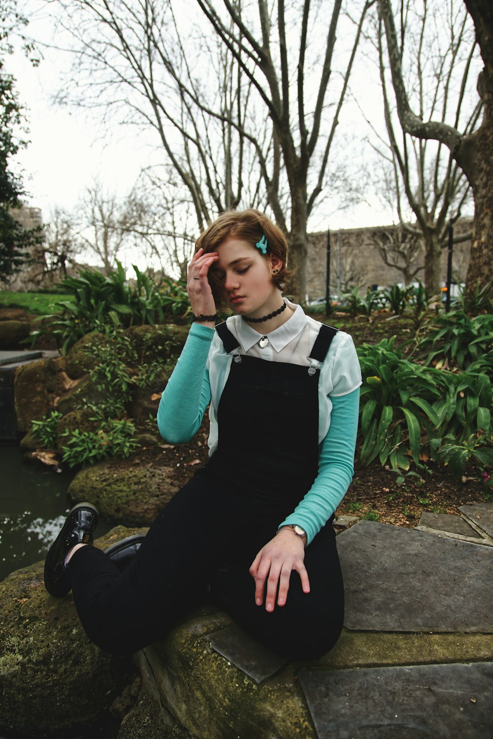 woman sitting on block