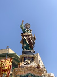 man in green suit statue