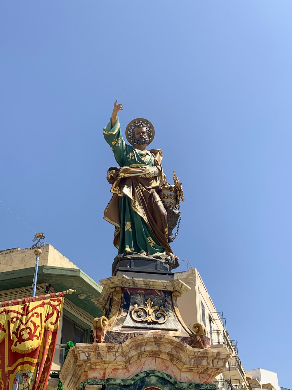 man in green suit statue