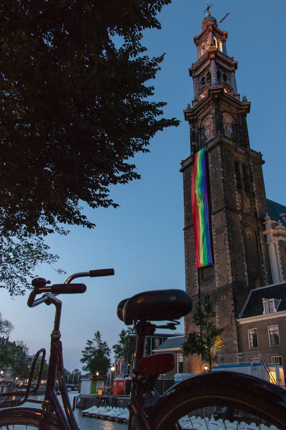 a bike parked in front of a tall building