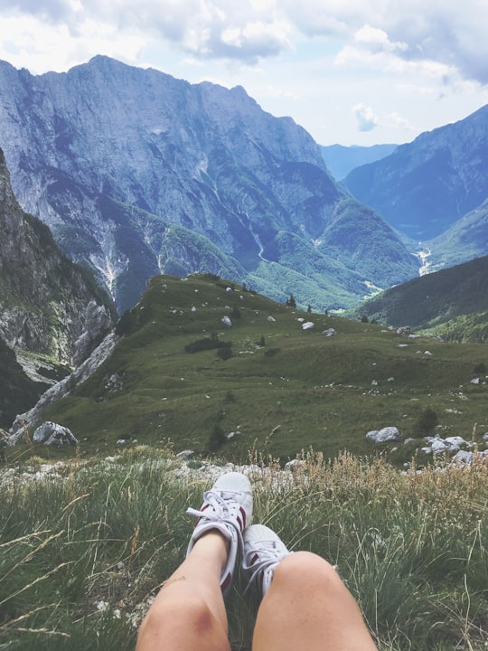 green field near mountains in Triglav National Park Slovenia