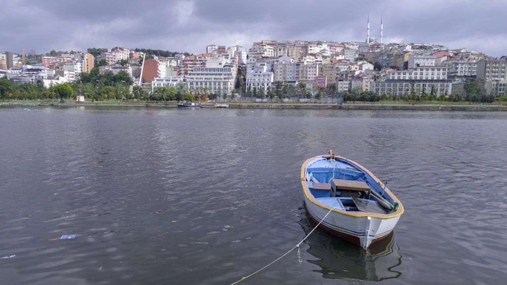 a small boat tied to a rope in a body of water