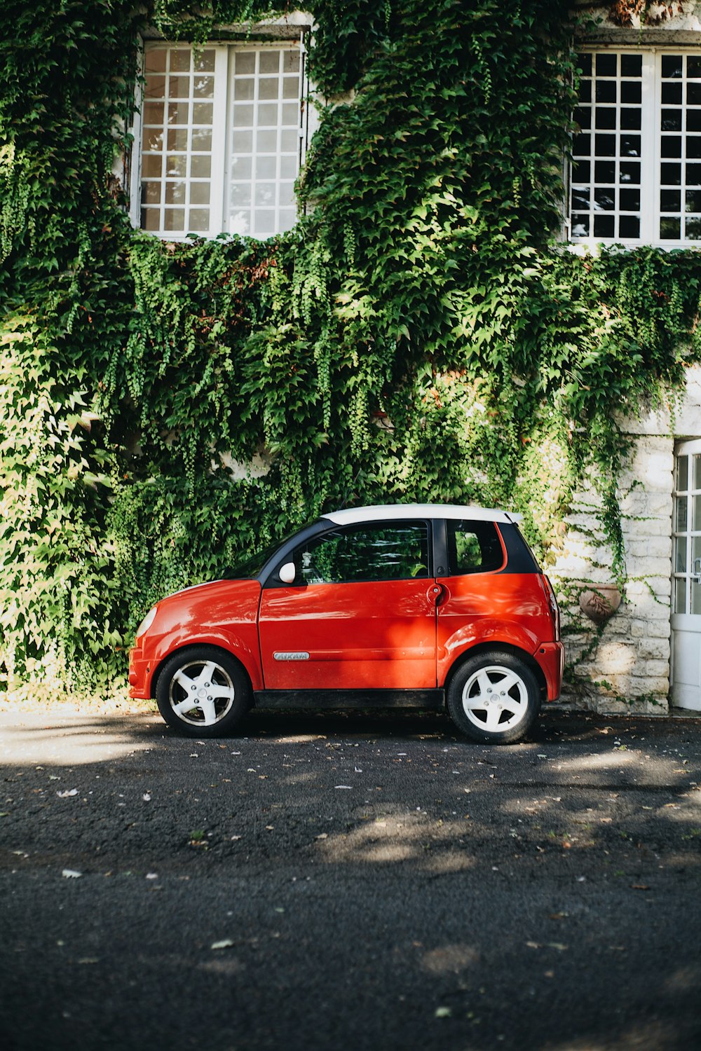 red smart car on road