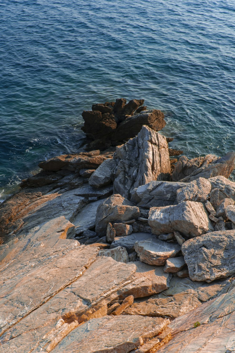 rock formations on rocky hill viewing sea