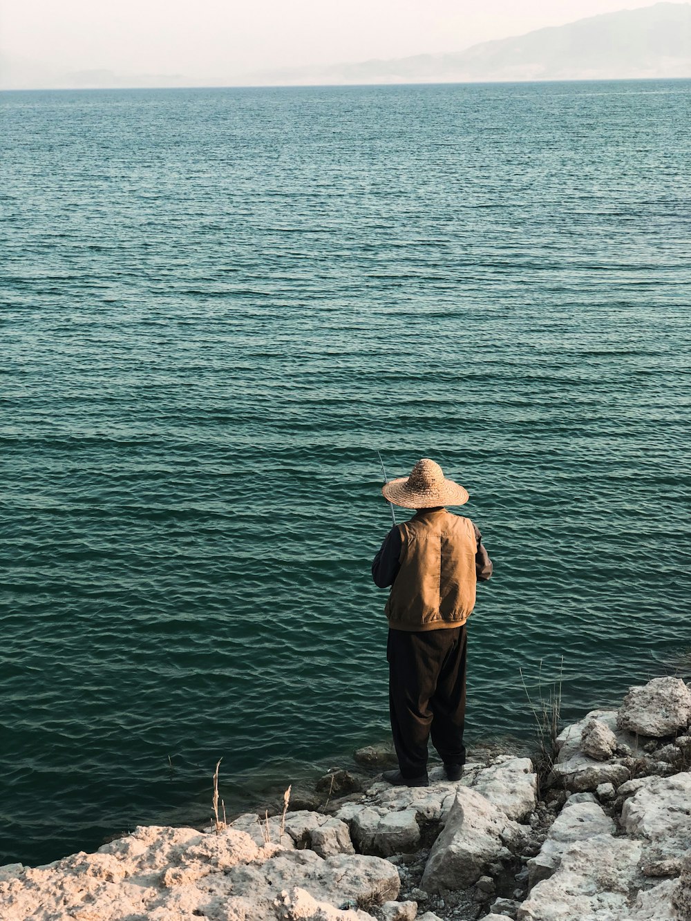 man standing on rocks