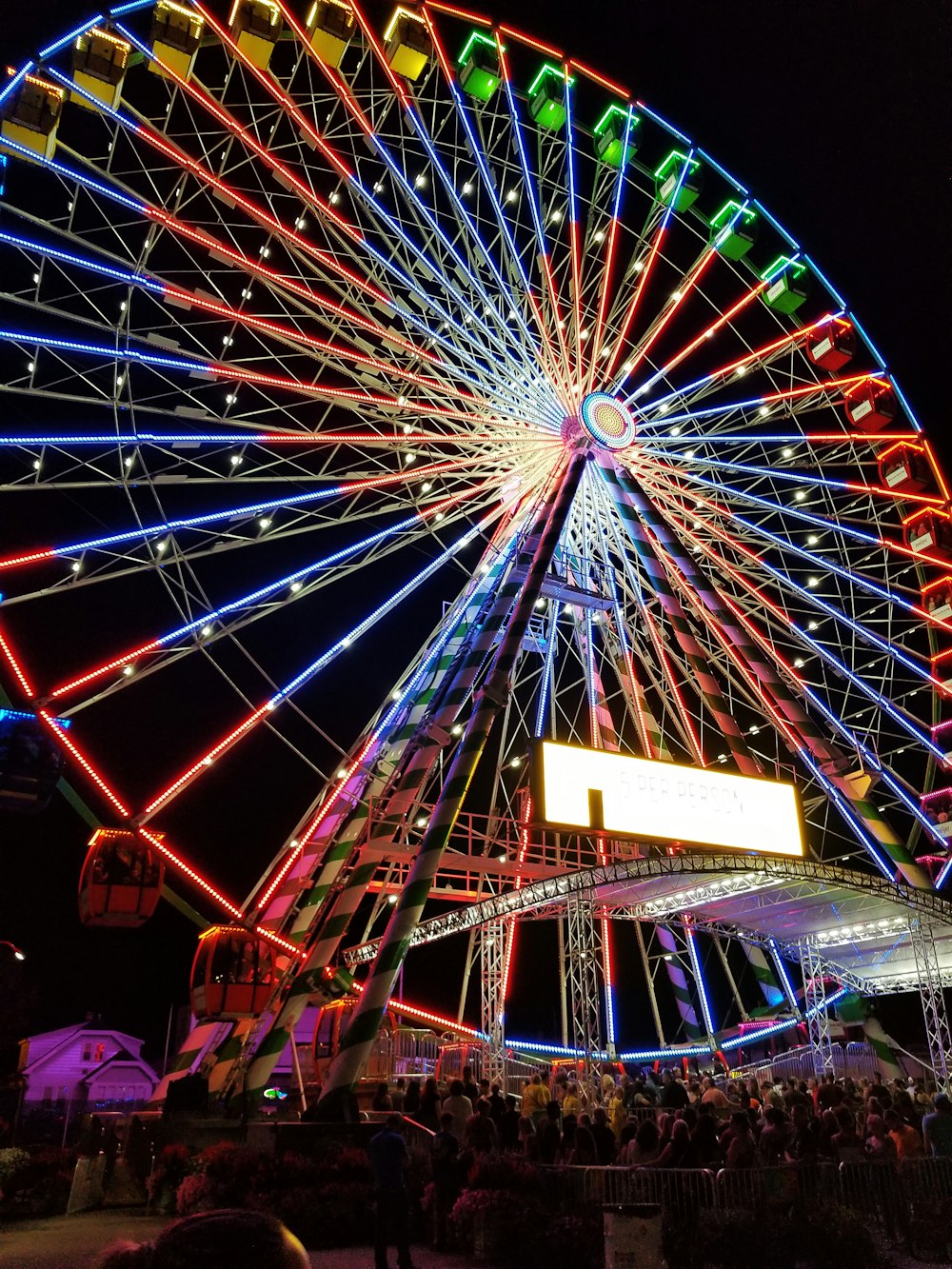 a large ferris wheel lit up at night