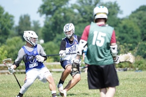 Action shot of an athlete wearing protective gear mid-play on a sunny day.