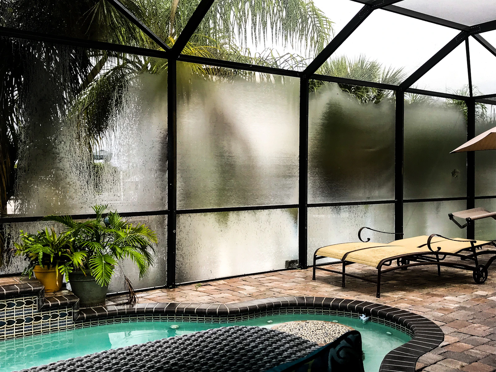 Screened pool and lanai behind a Boca Raton home, typical of houses selling near one million dollars