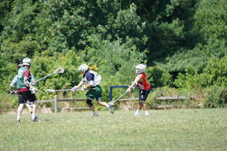 A vibrant lacrosse field with players in action during a match.