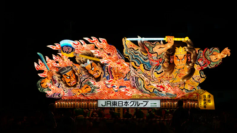 Nebuta Festival participants pulling an illuminated float through the streets of Aomori