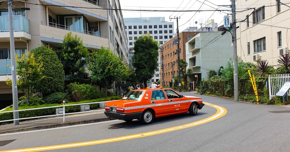 red taxi on road