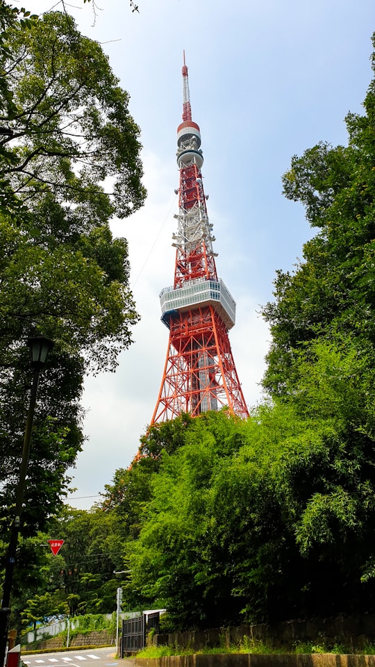 orange and white tower in Tokyo Tower Japan