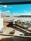 white airplane at the airport during daytime
