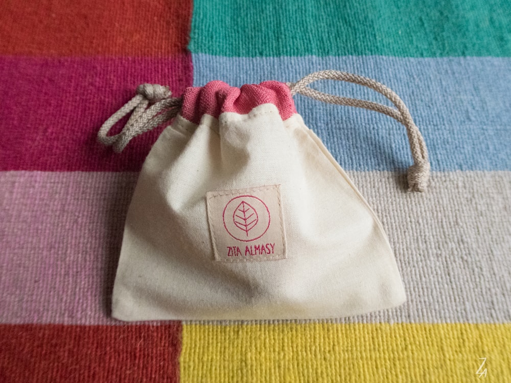 red and brown pouch close-up photography