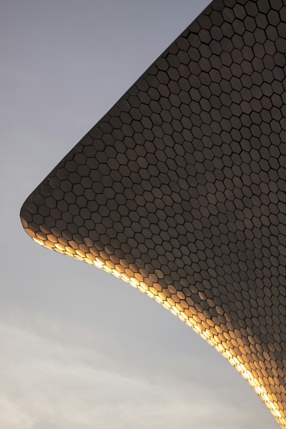 a close up of a building with a sky background