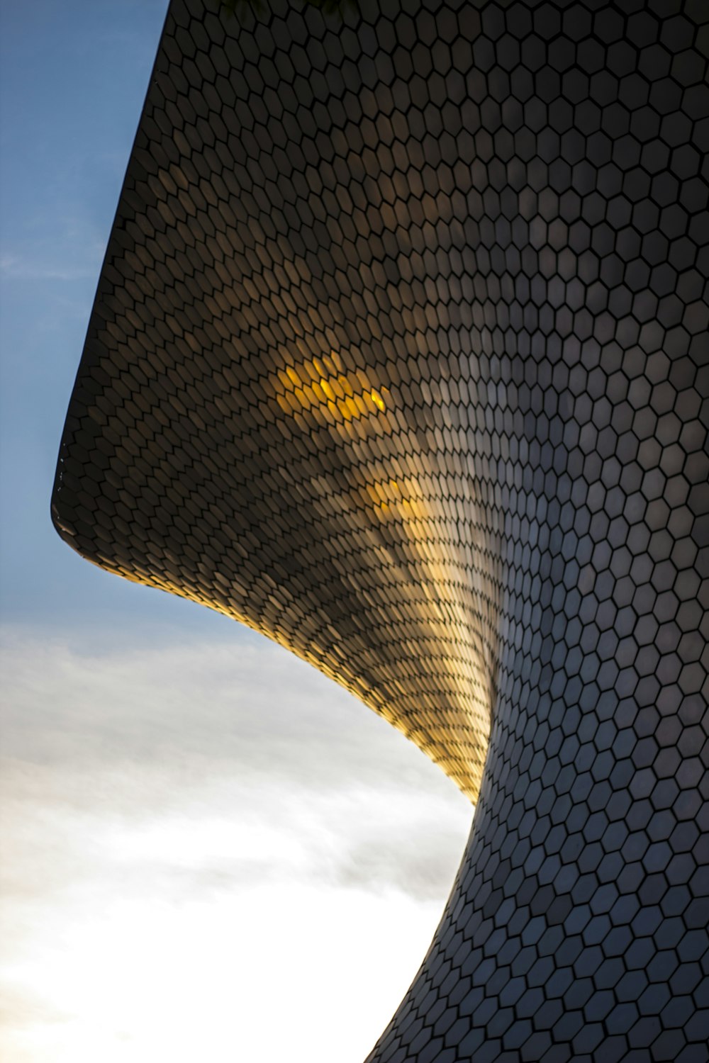 a close up of a building with a sky background