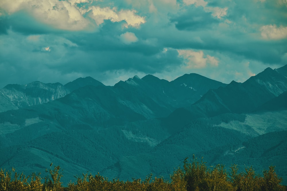 mountain under white clouds