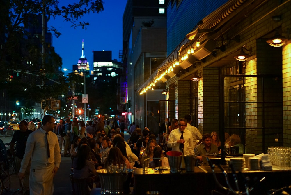 people eating outside building