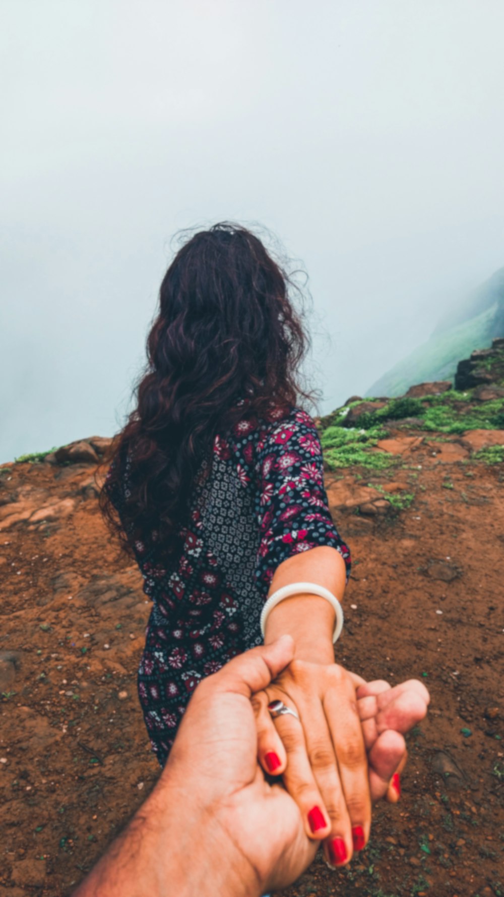 a person holding the hand of another person