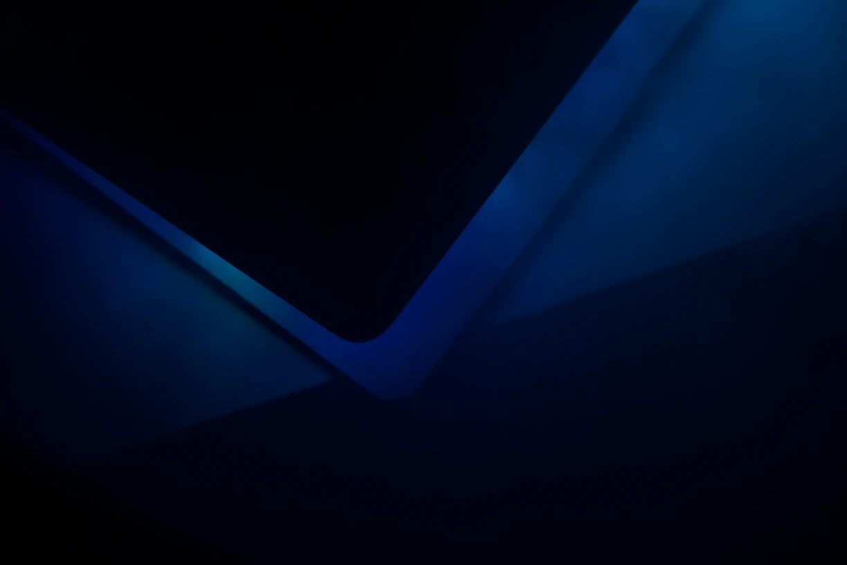 a black and blue background with a triangular shape
