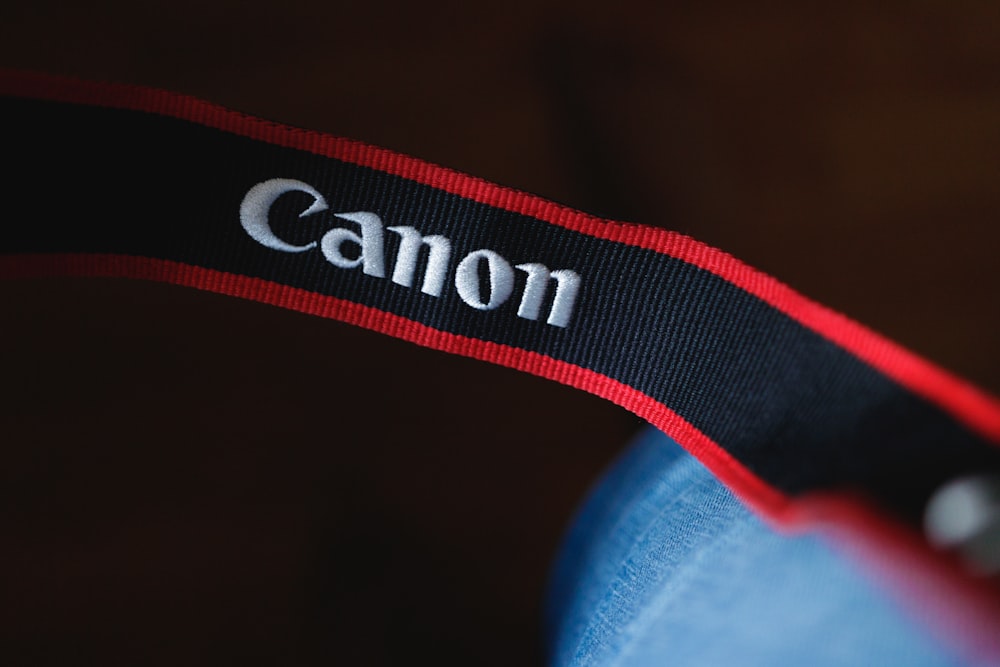 white and black Canon strap