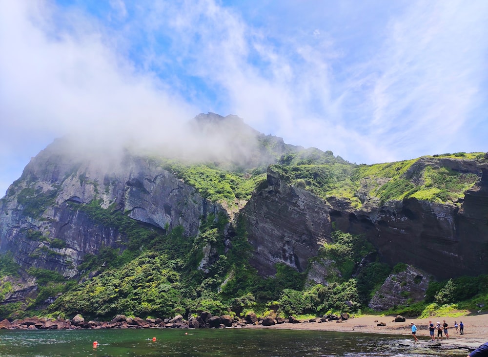 mountain near body of water during daytime