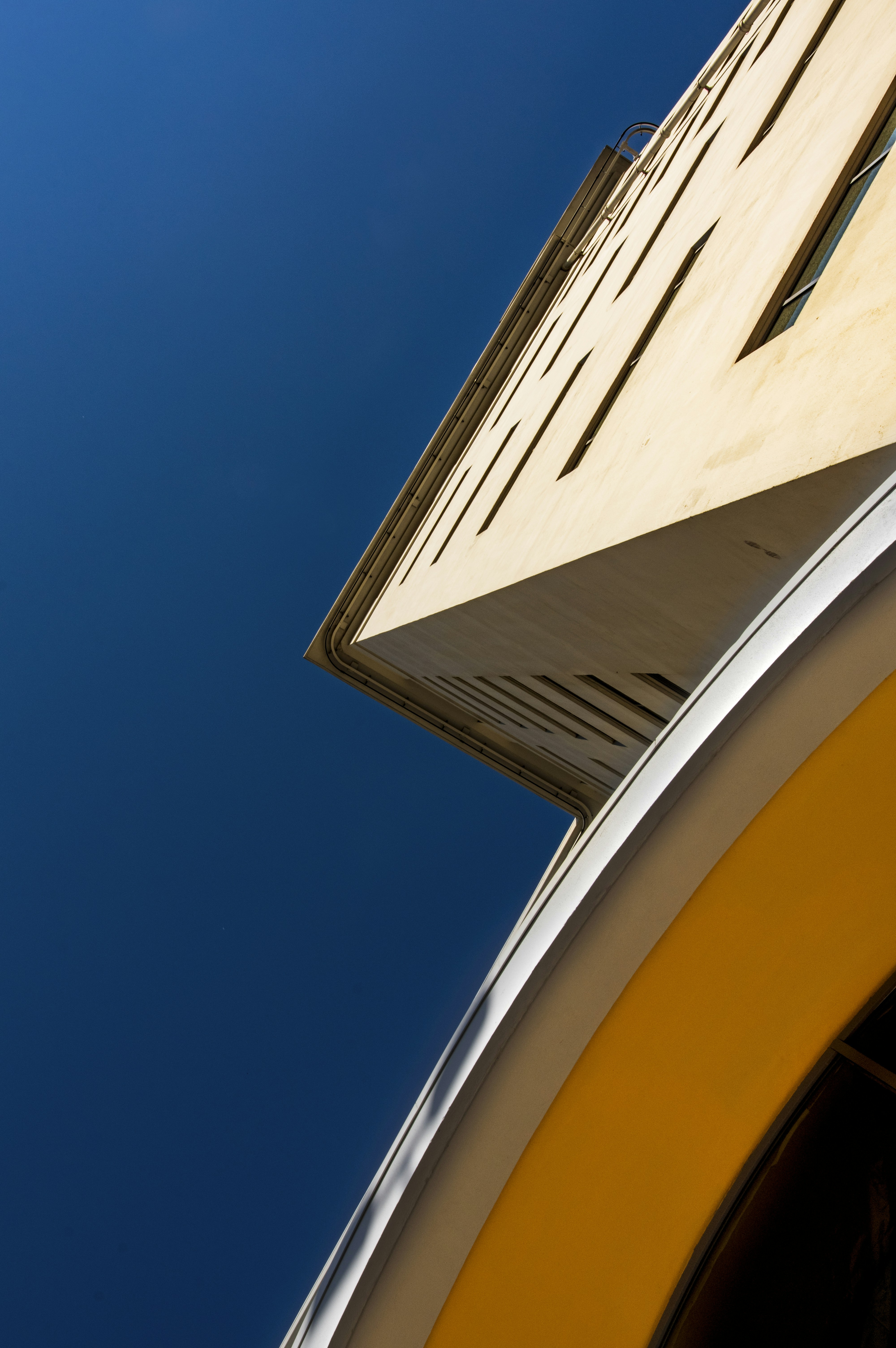 brown concrete building under blue sky during daytime