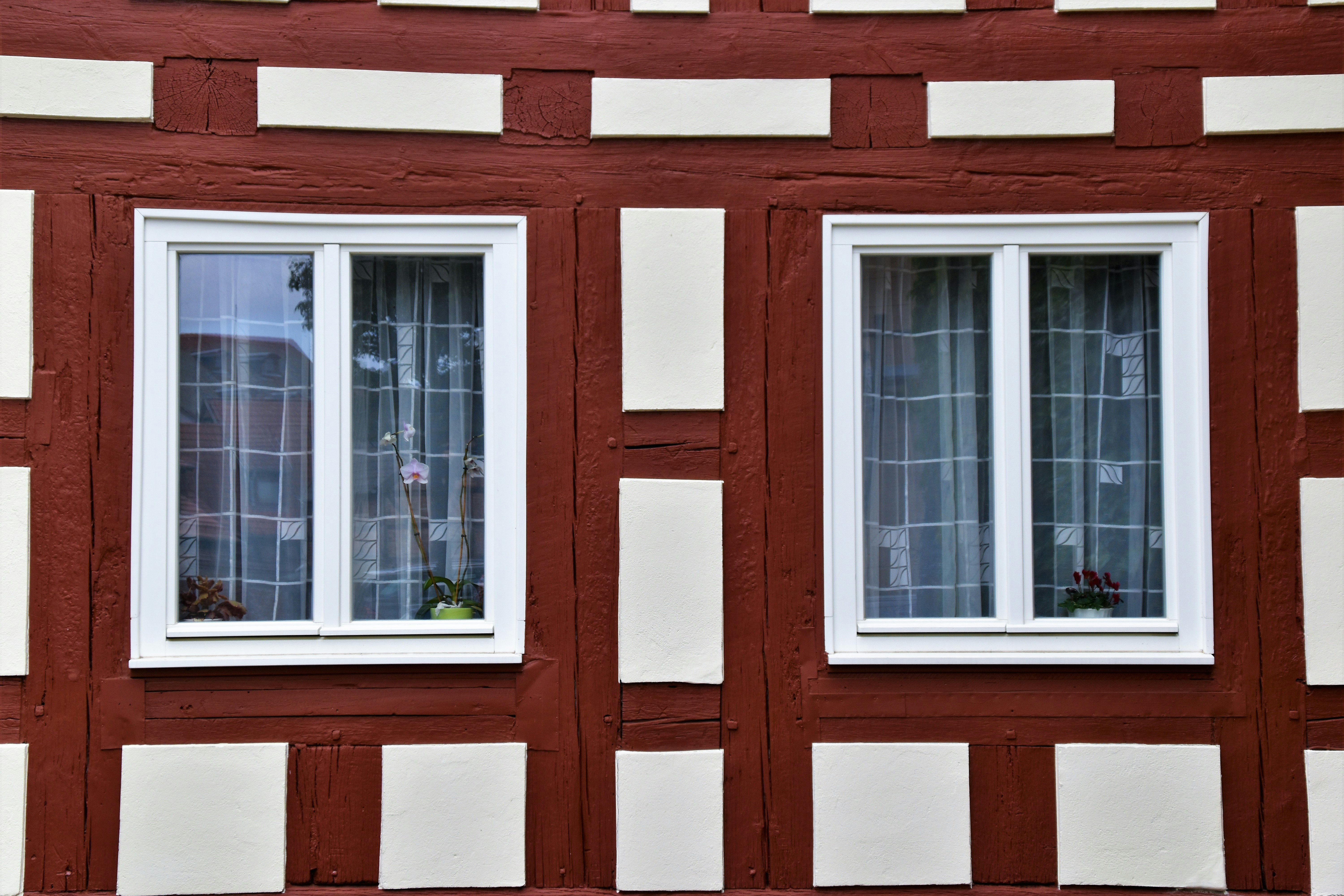 brown and beige wooden framed clear glass windows