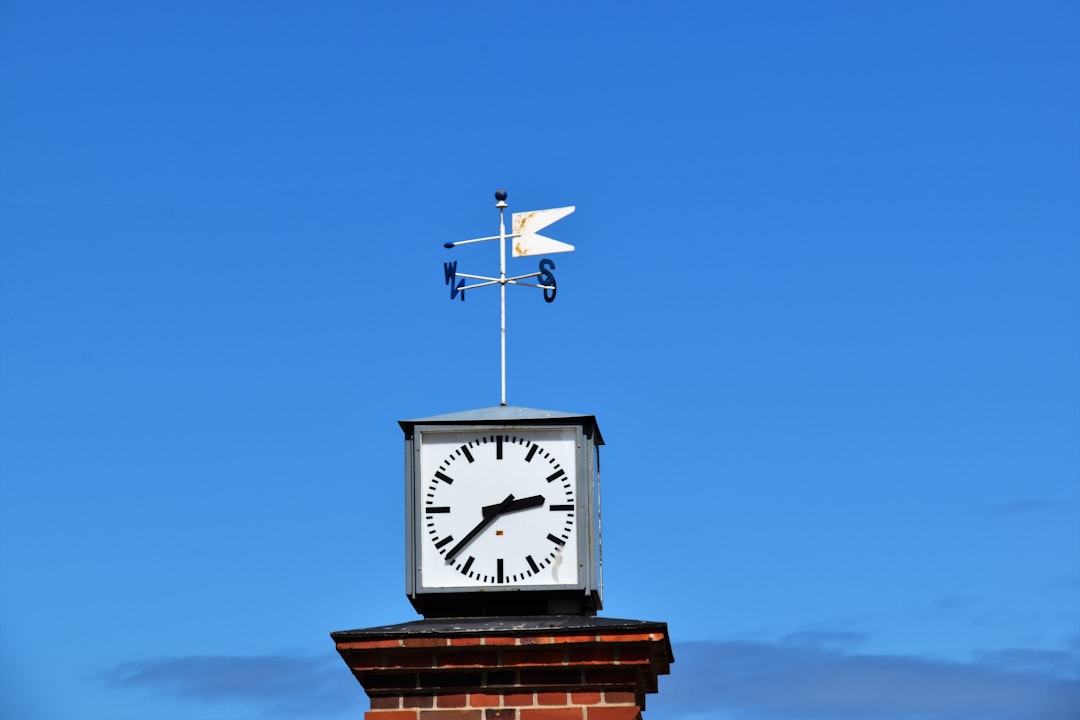 white concrete clock at daytime